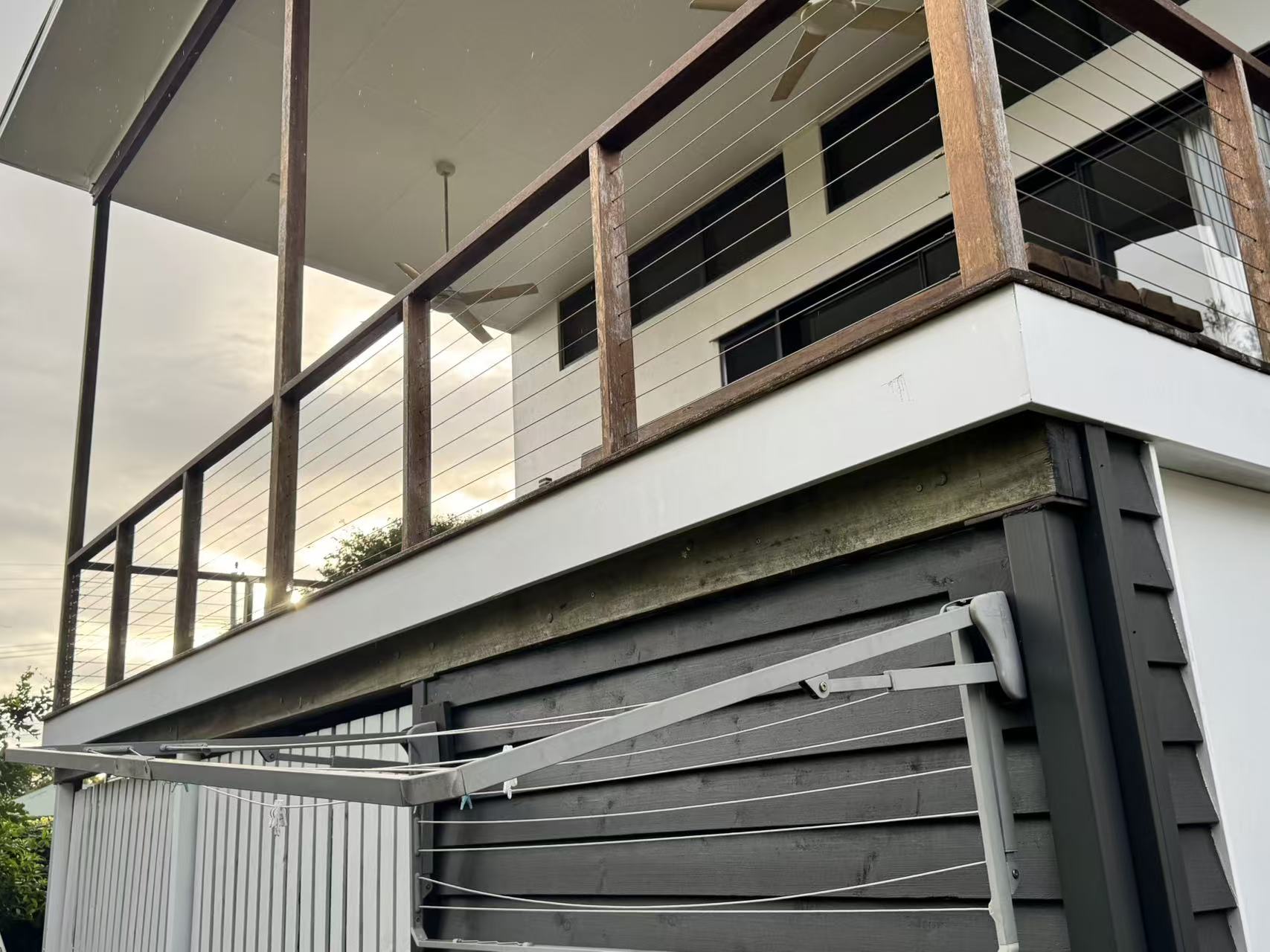 In-progress view showing painting work at a railing section.